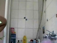 Girl shaving in shower